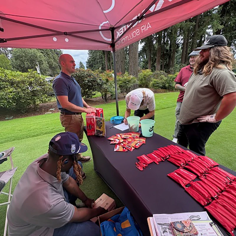 Golfers at the Nortek Air Solutions booth during the Tualatin Chamber Golf Classic in Tualatin, Oregon.