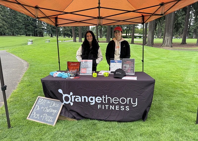 Orangetheory Fitness booth at the Tualatin Chamber golf event in Tualatin, Oregon.
