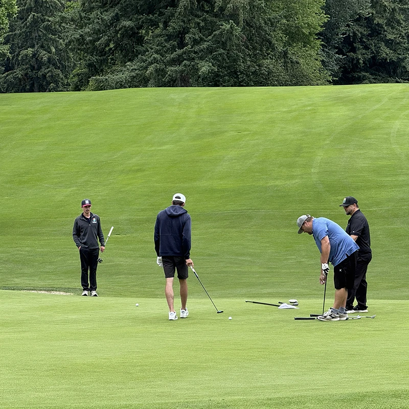 Golfers putting at the Tualatin Chamber Golf Classic in Tualatin, Oregon.