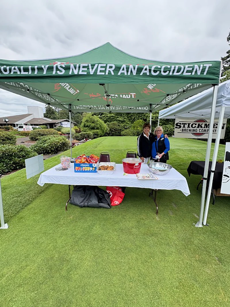 Tualatin Auto Body refreshment booth at the Tualatin Chamber Golf Classic in Tualatin, Oregon.