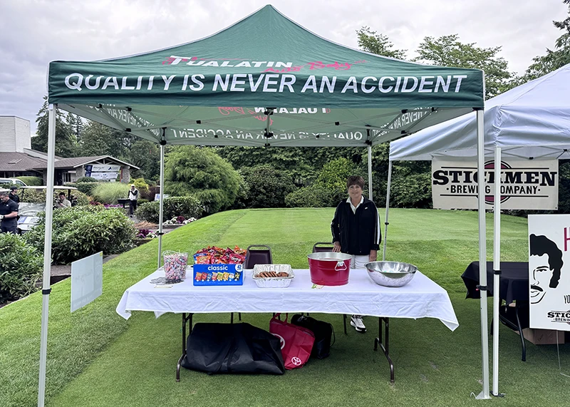 Tualatin Auto Body refreshment booth at the Tualatin Chamber golf event in Tualatin, Oregon.